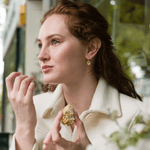 Model wearing Emily Heart and Star Hook Earrings In Gold