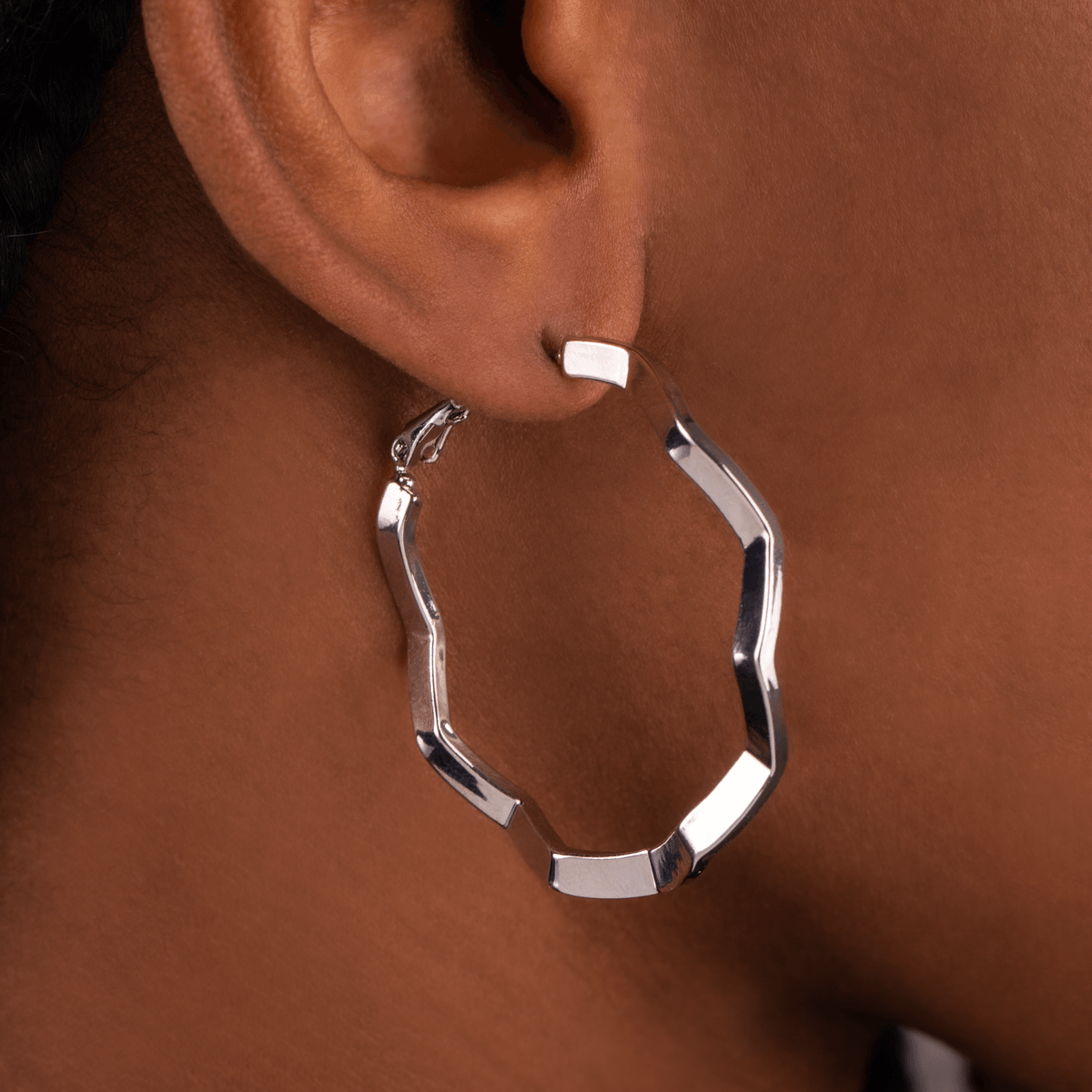 Model wearing Eternal Abstract Hoop Earrings in Silver