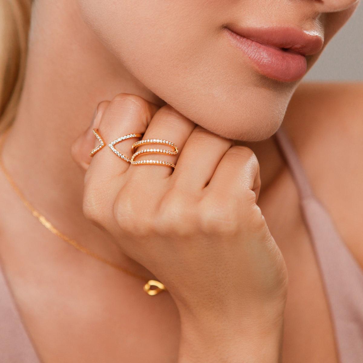 Model wearing Kylie Gold Cubic Zirconia Delicate Curve Ring In Gold