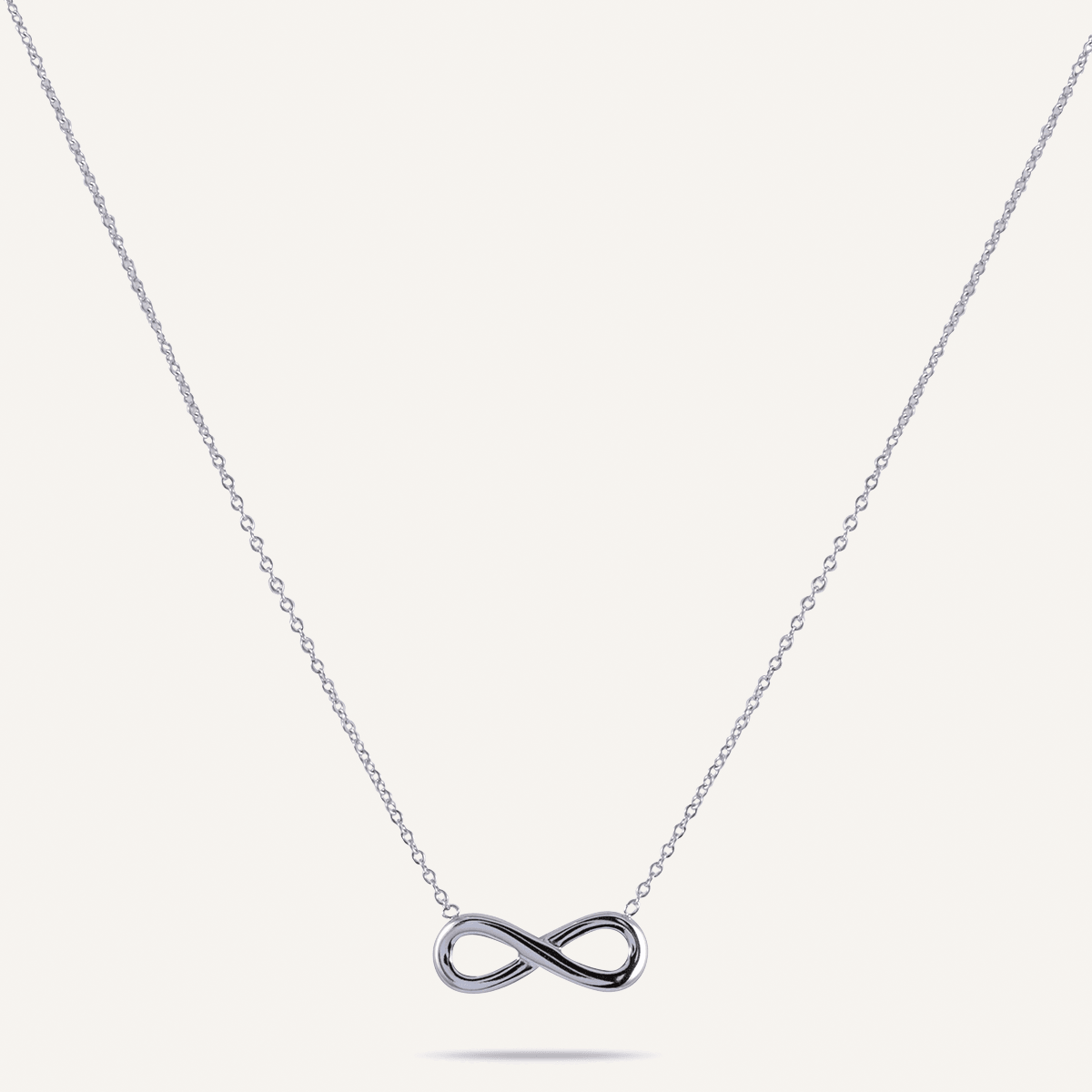 Keira Infinity Symbol Pendant Necklace In White Gold-Tone