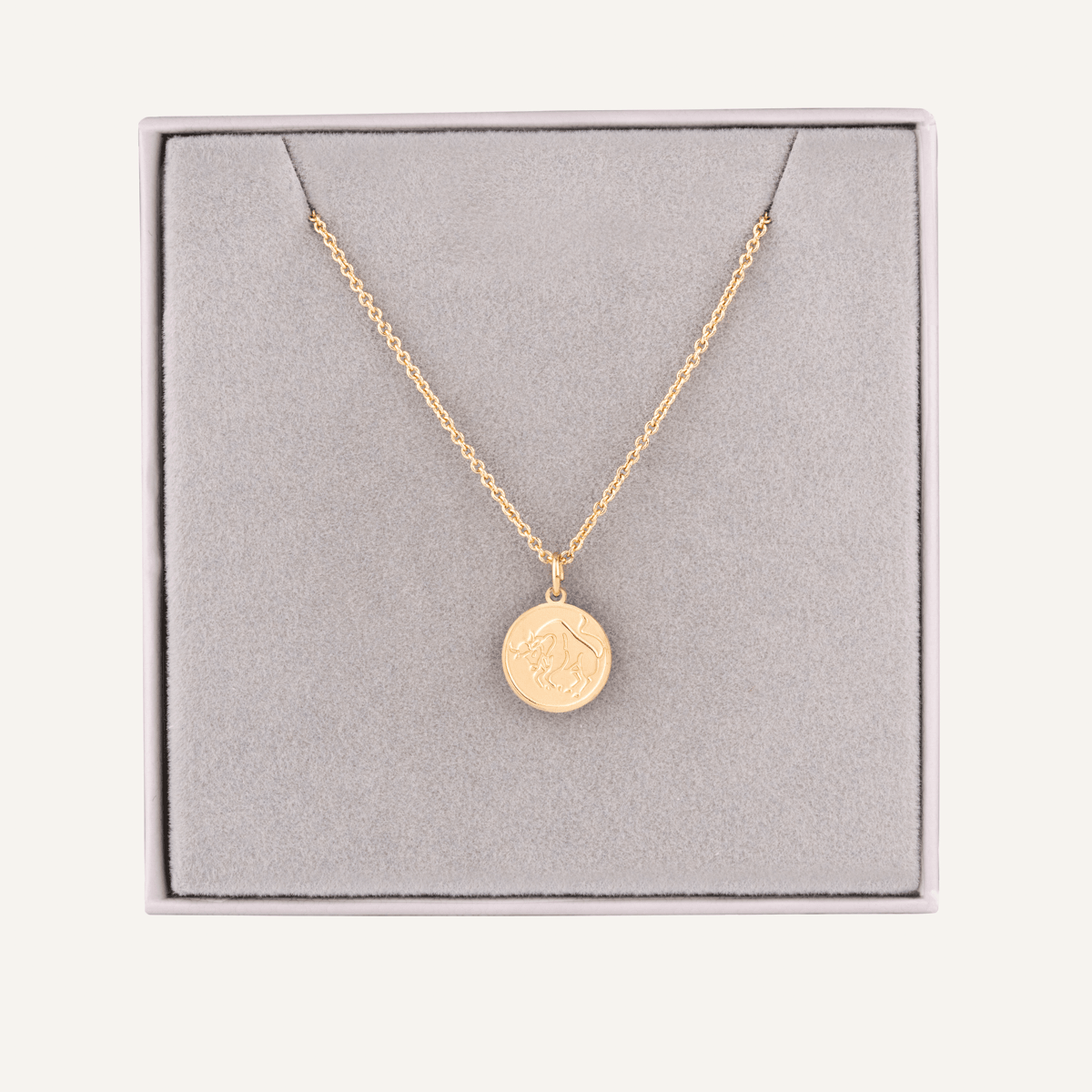 Close-up view of Taurus Zodiac Necklace In Gold (April 20 – May 20)