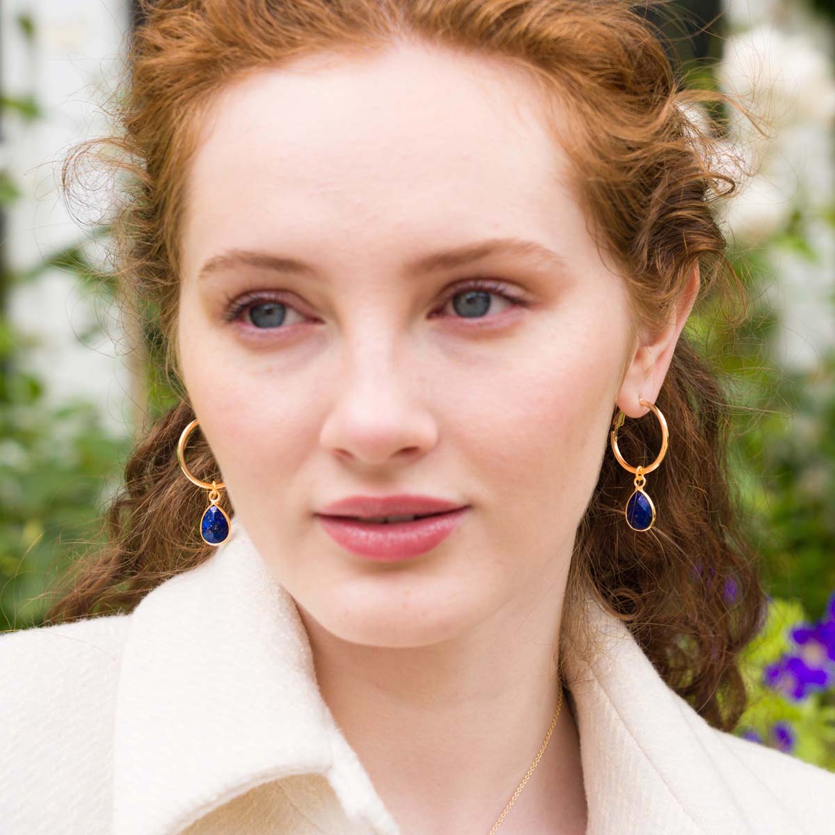 Model wearing Lapis Gold Lever Earrings