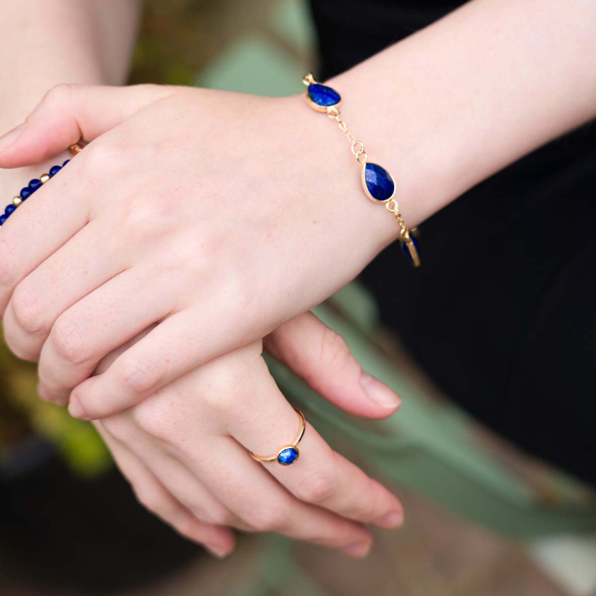 Model wearing Natural Lapis Stone Gold Clasp Bracelet