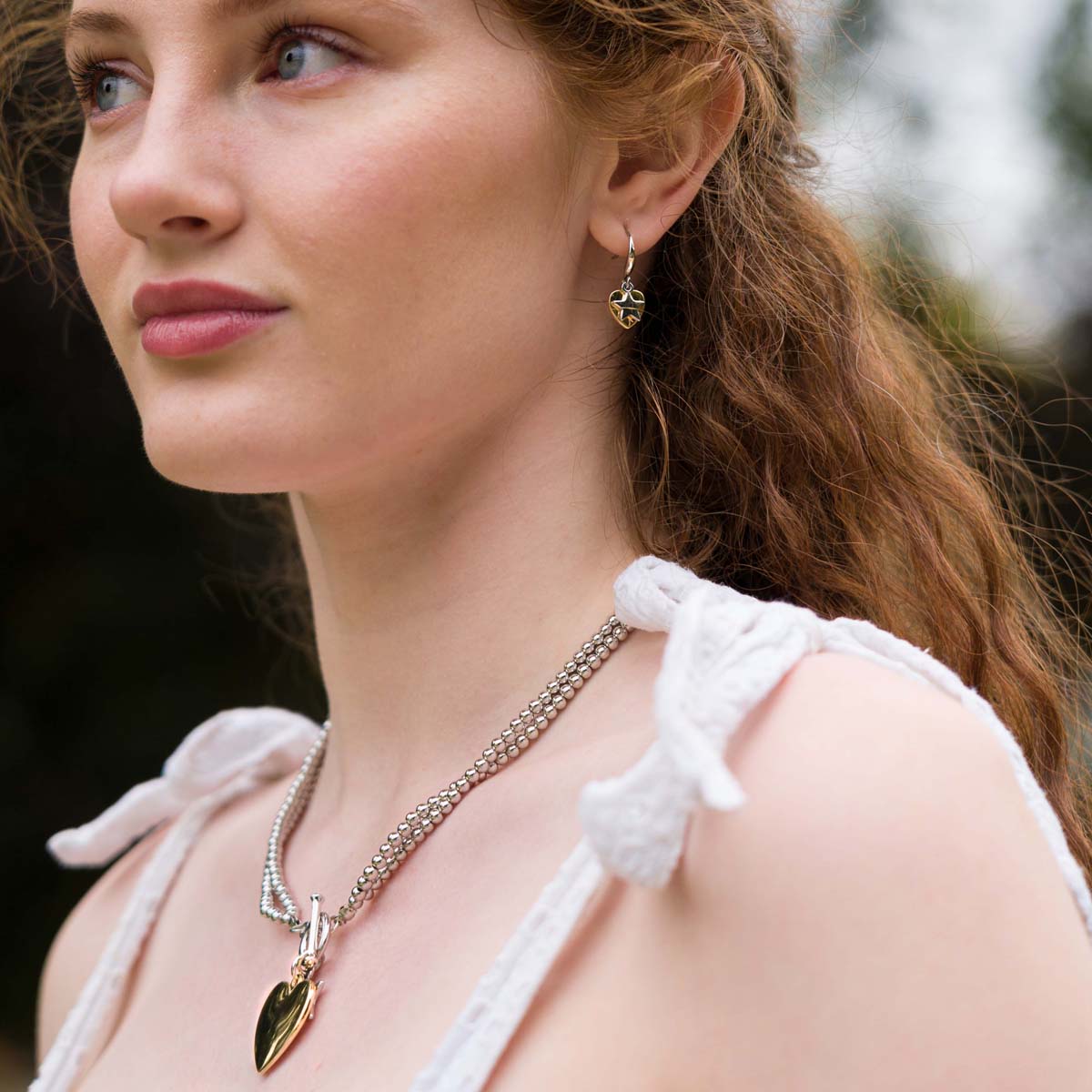 Model wearing Emily Heart and Star Necklace In Silver