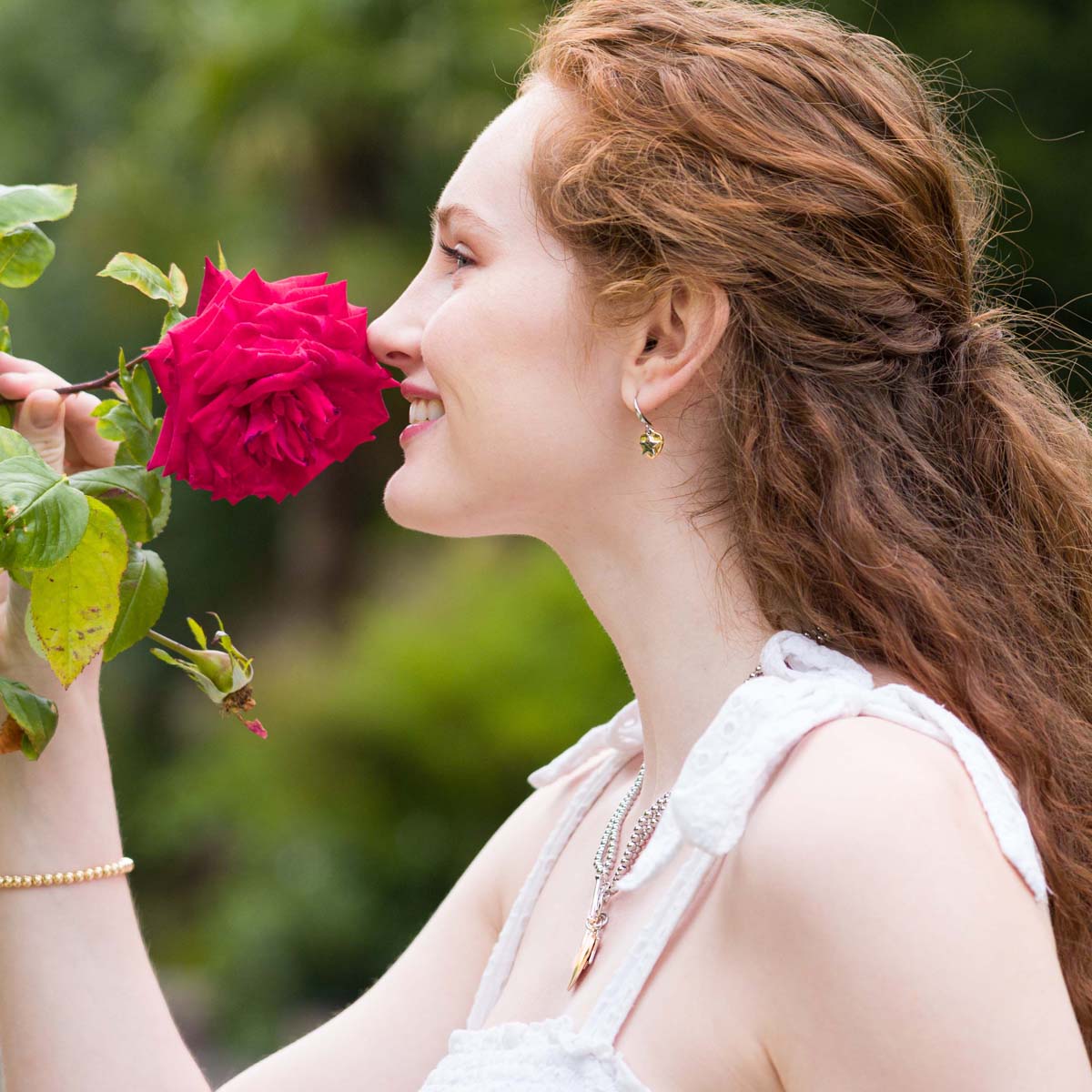 Model wearing Emily Heart and Star Hook Earrings In Silver