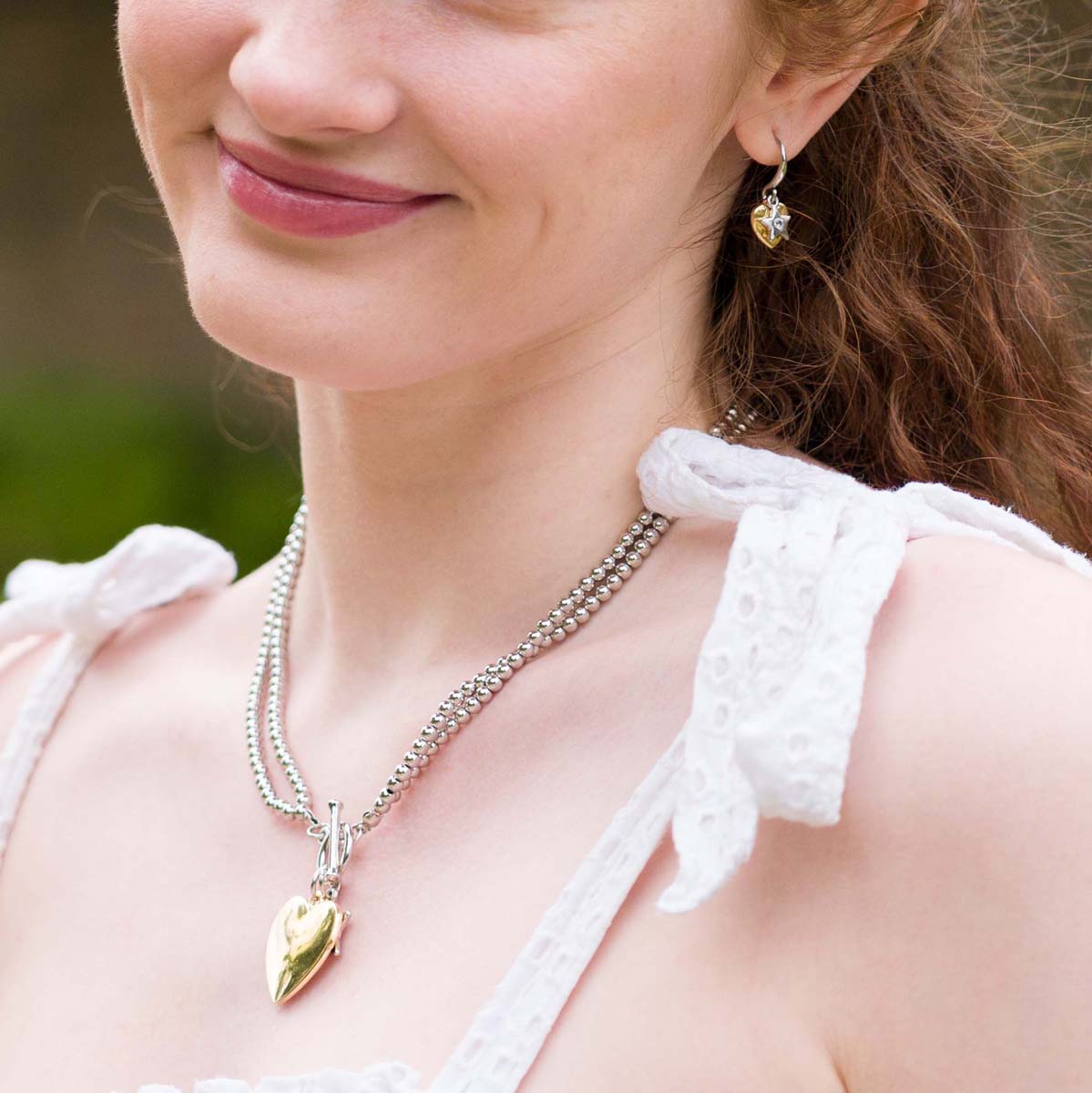 Model wearing Emily Heart and Star Necklace In Silver