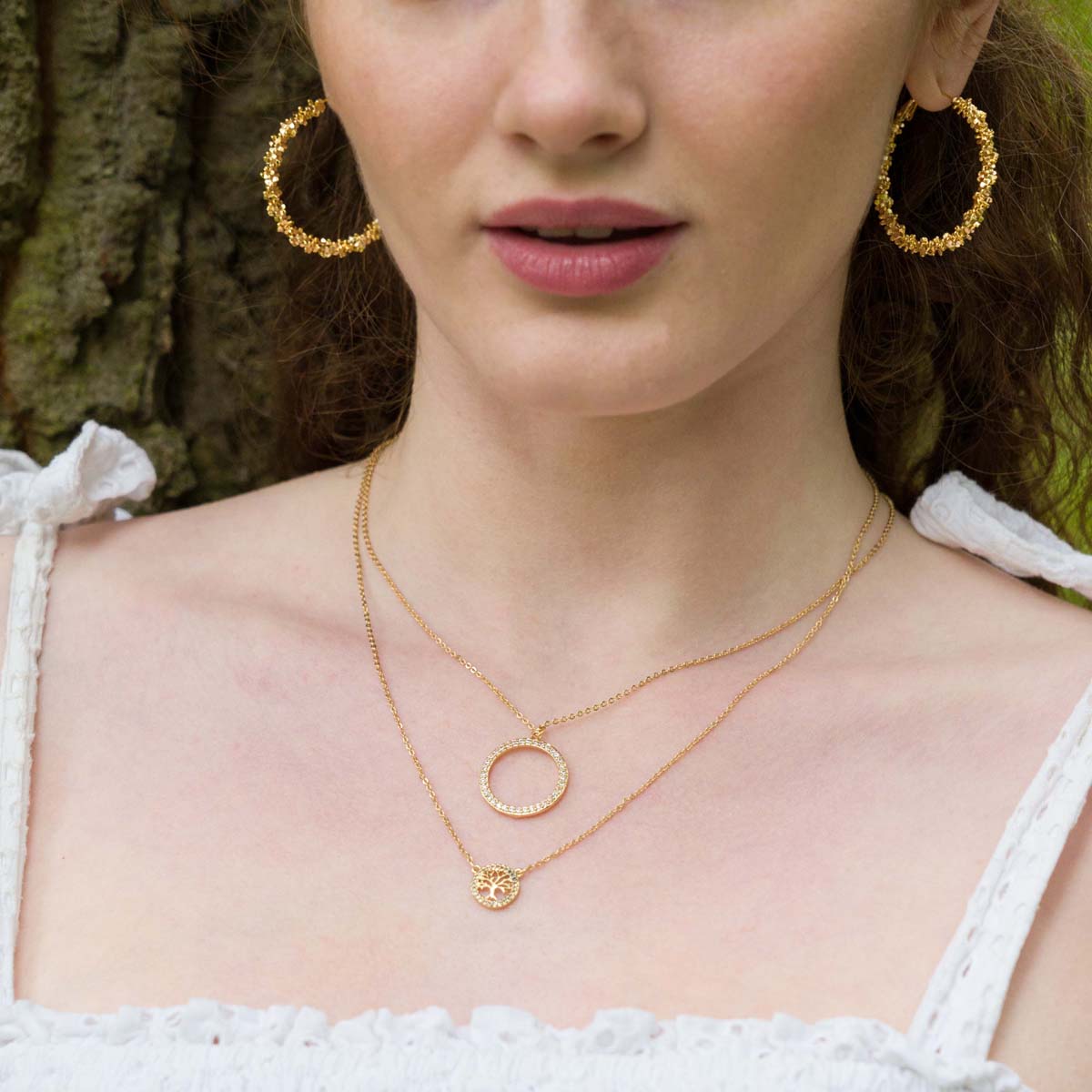 Model wearing Vivienne Circle Pendant Necklace in Gold & Cubic Zirconia