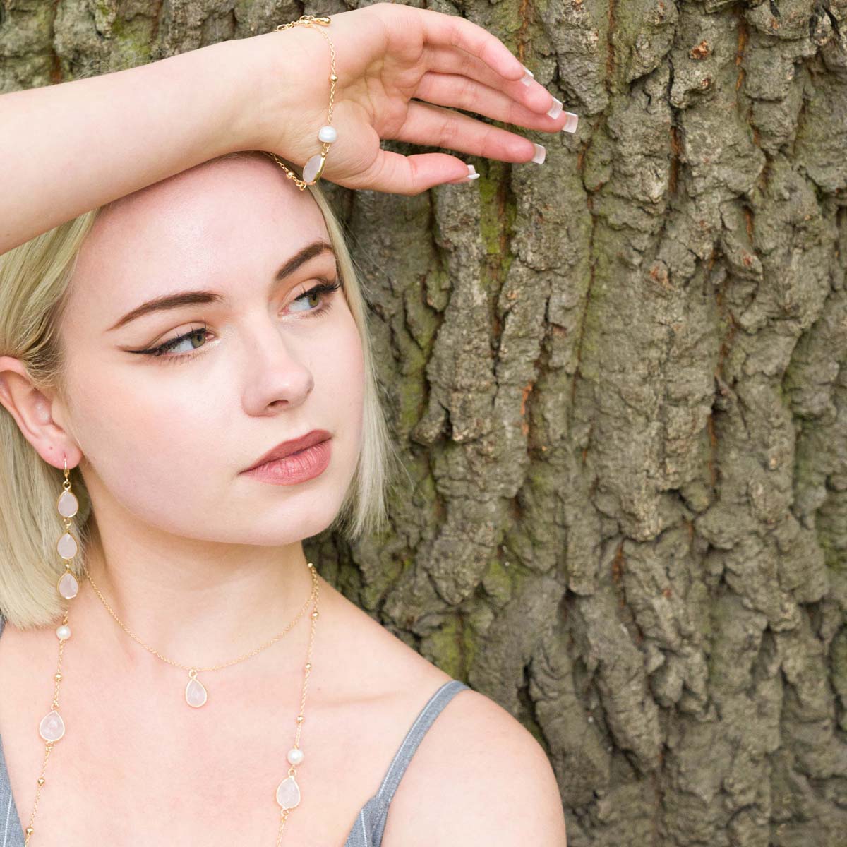 Model wearing Long Moonstone & Pearl Crystal Stone Gold Necklace
