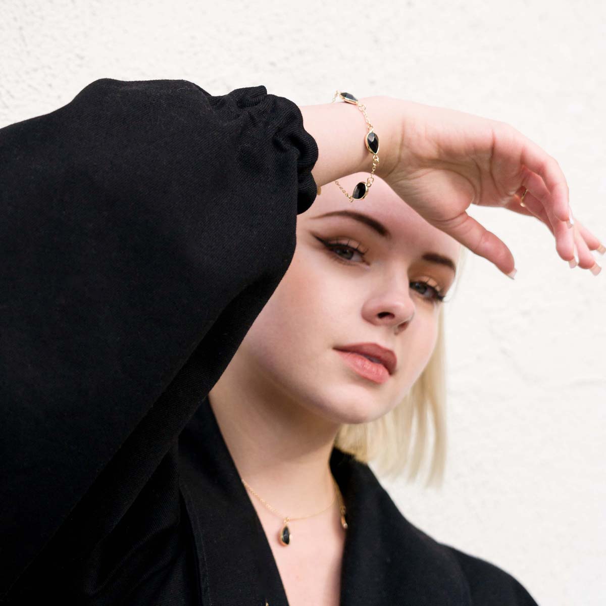 Model wearing Natural Black Spinel Stone Gold Clasp Bracelet