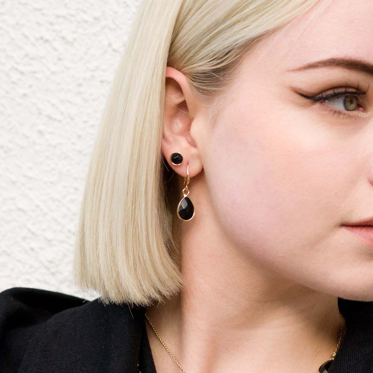 Model wearing the earrings of Semi-Precious Stone Set in Gold & Black Spinel