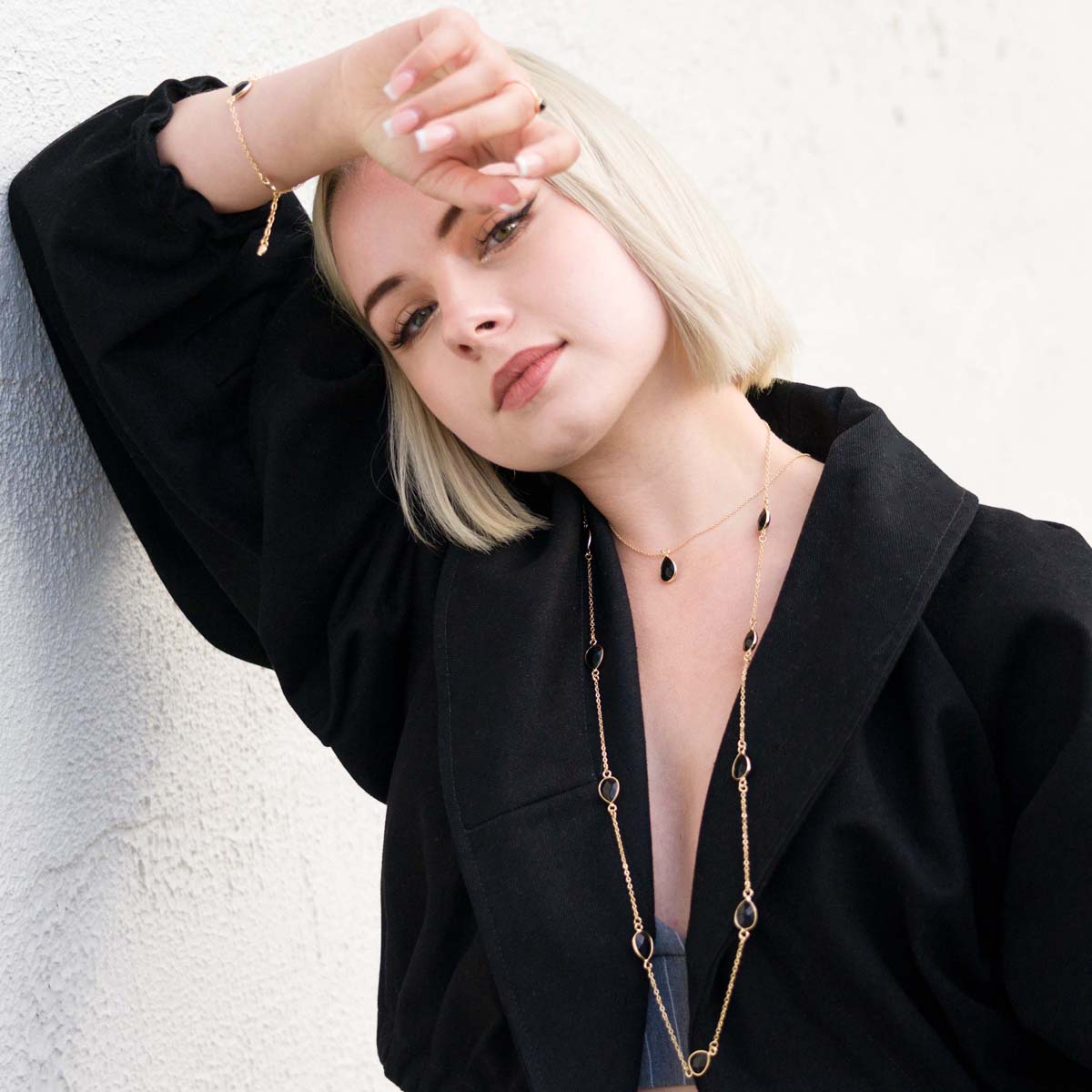 Model wearing Long Black Spinel Multi Crystal Gold Necklace