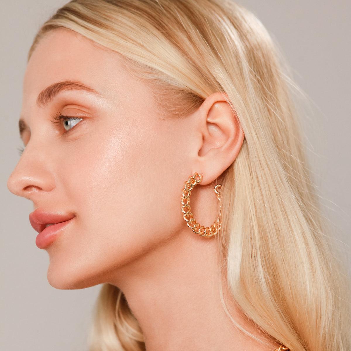 Model wearing Eternal Narrow Curb Chain Hoop Earrings in Gold