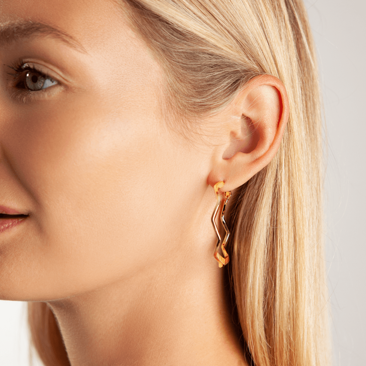 Model wearing Eternal Abstract Hoop Earrings in Gold