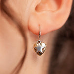 Model wearing Emily Heart and Star Hook Earrings In Silver