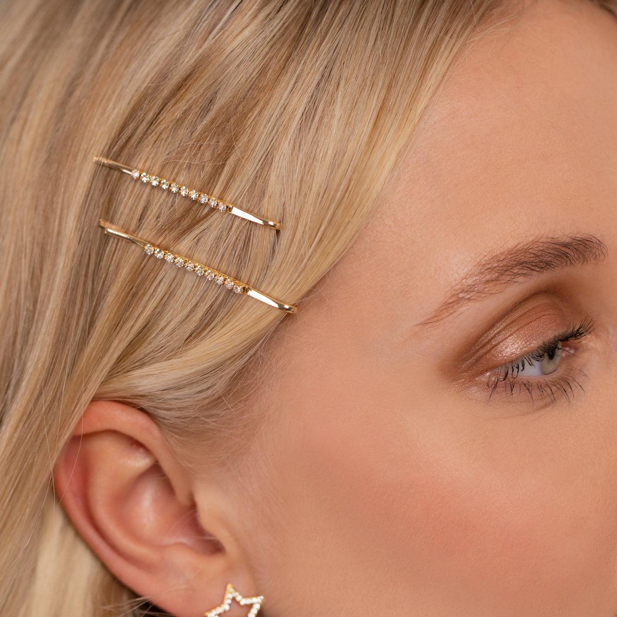 Model wearing Kylie Contemporary Crystal Hairclip In Gold