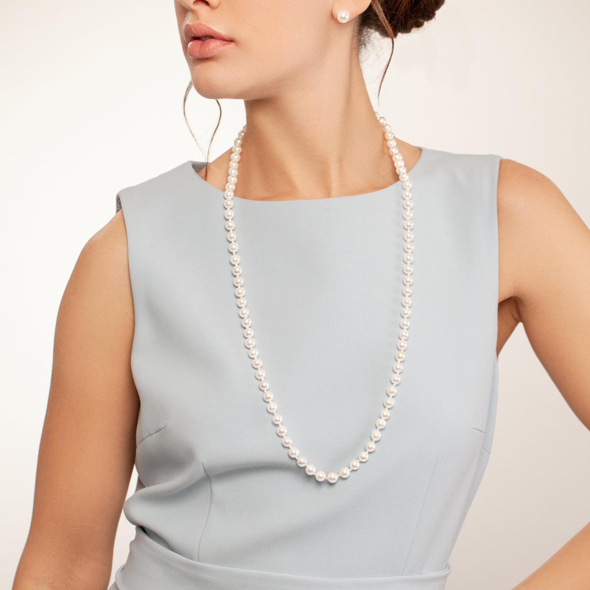 Model wearing Audrey Mother of Pearl Classic Long Beaded Necklace