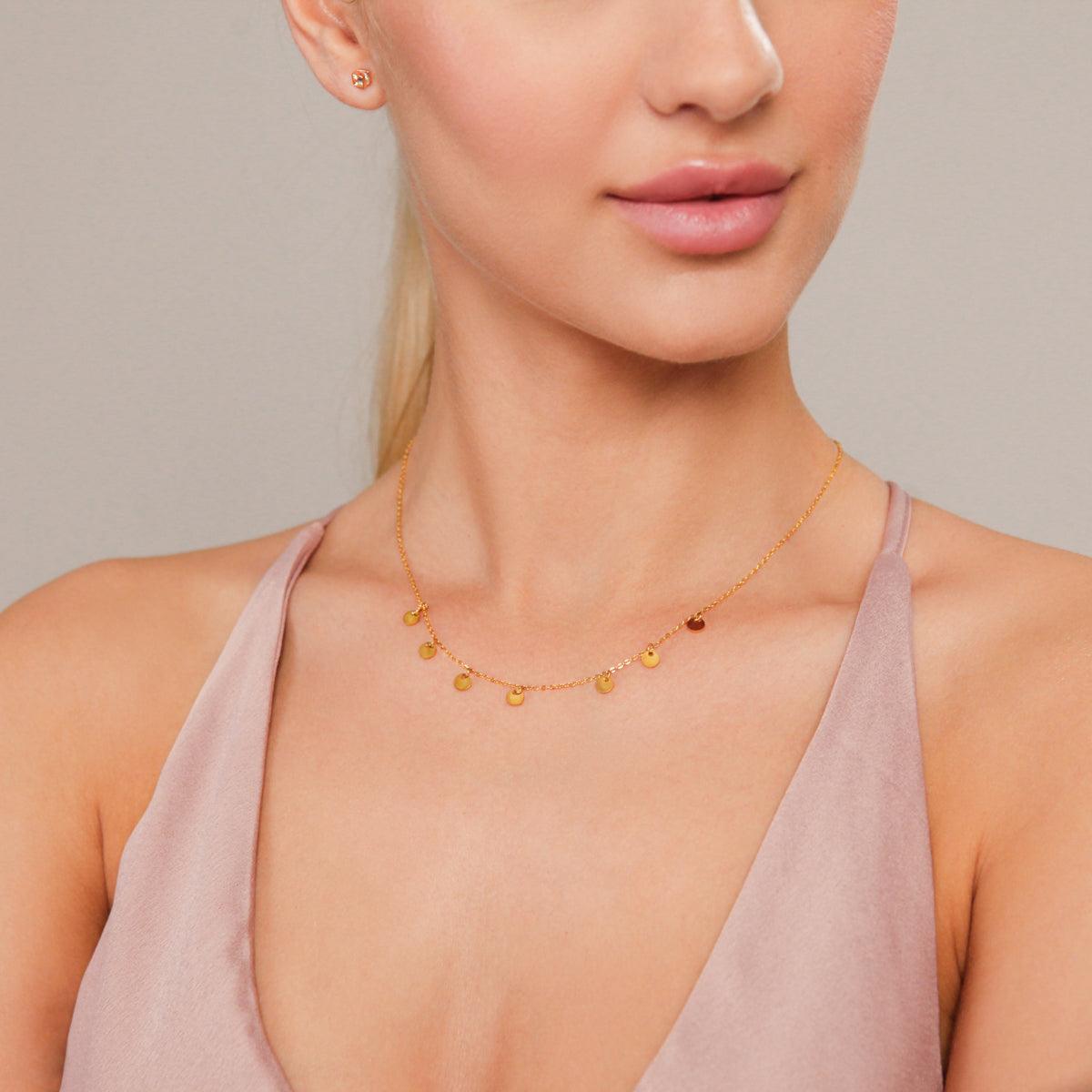 Model wearing Keira Gold Discs Short Necklace