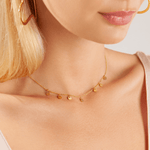 Model wearing Keira Gold Discs Short Necklace