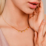 Model wearing Keira Gold Hearts Short Necklace