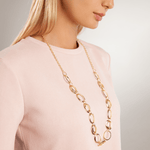 Model wearing Geo Ovals Long Necklace In Gold in side view