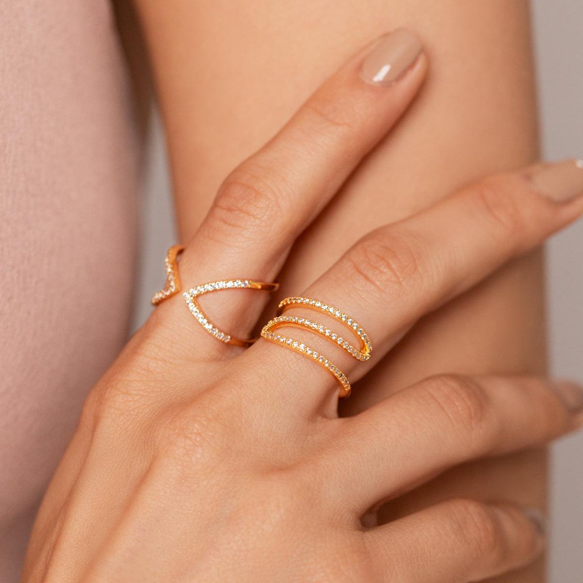 Model wearing Kylie Gold Cubic Zirconia Delicate Curve Ring In Gold