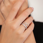 Model wearing Kylie Gold Cubic Zirconia Criss Cross Band Ring In White Gold