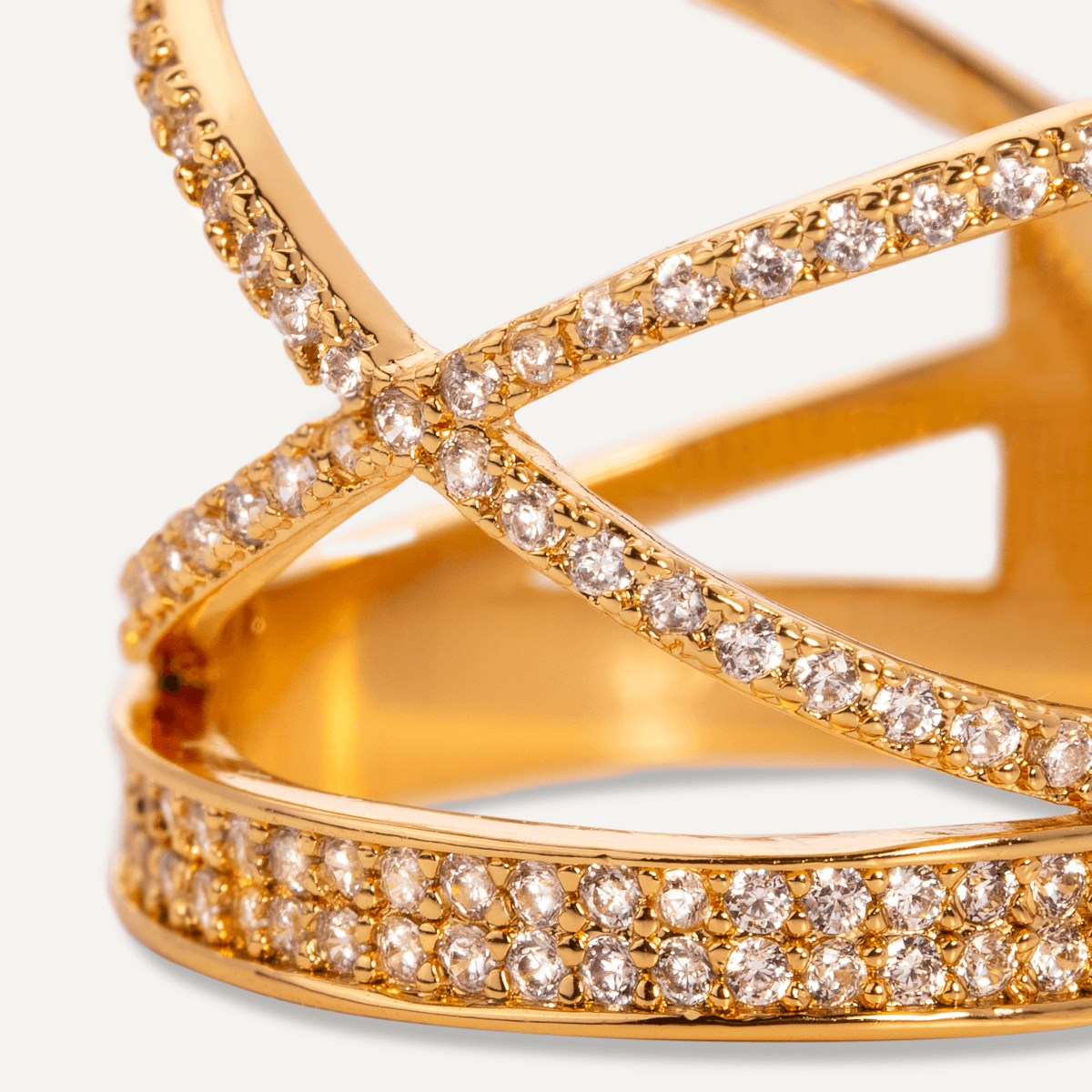 Detailed view of Kylie Gold Cubic Zirconia Criss Cross Band Ring In Gold