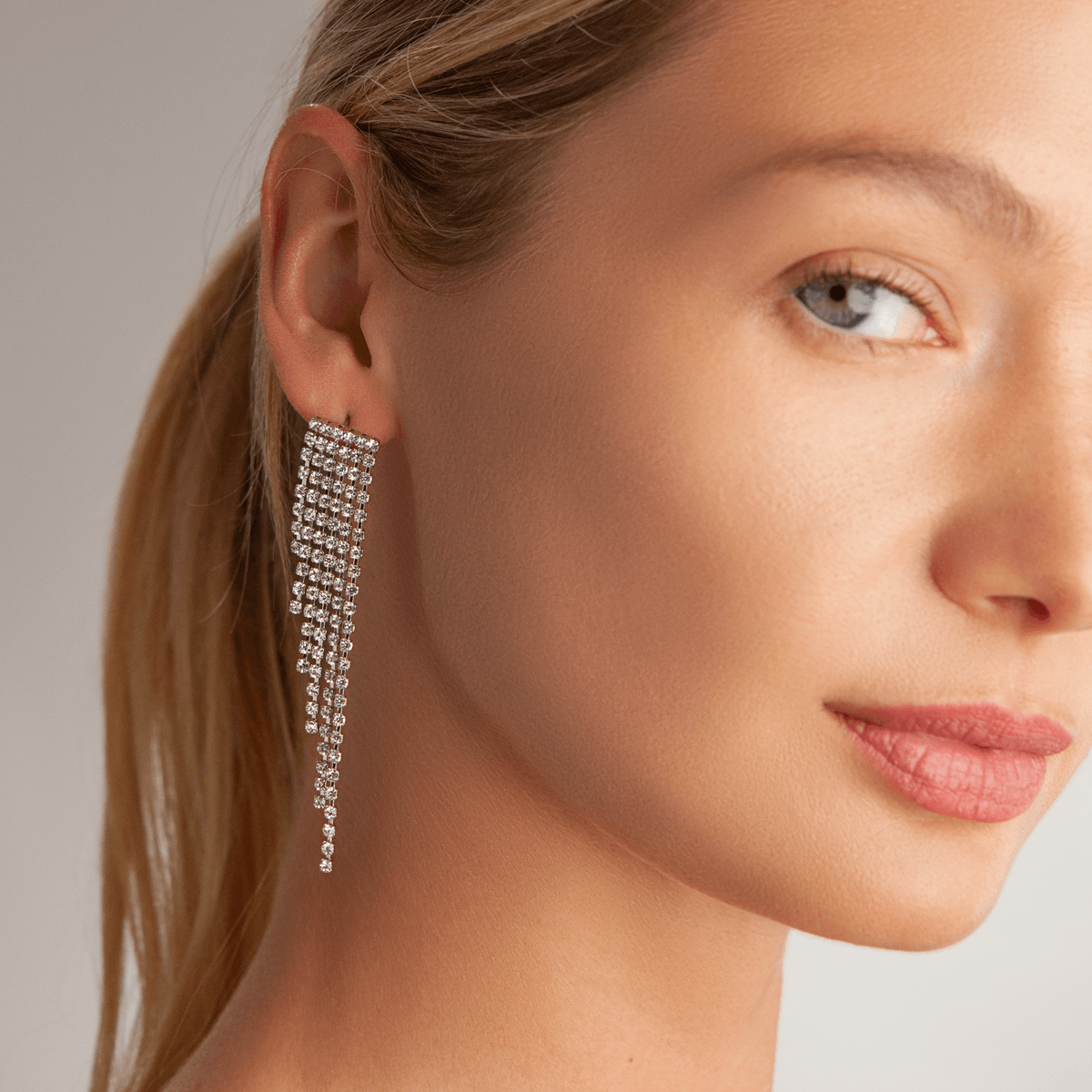 Model wearing Vivienne Fringed Dangle Earrings In Silver & Crystal