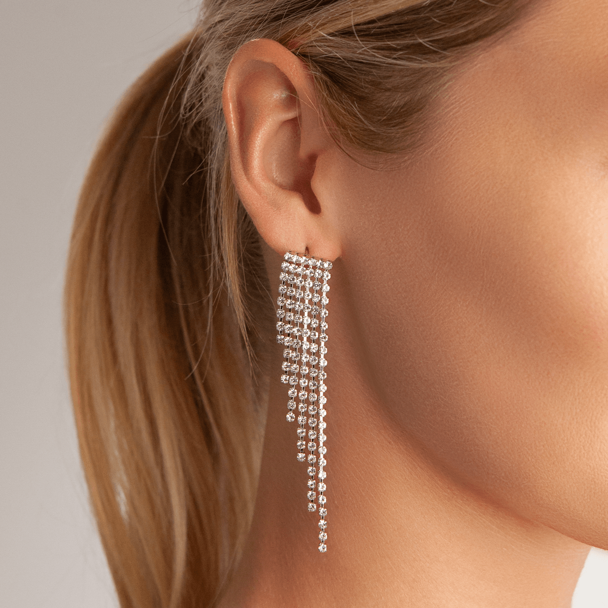 Model wearing Vivienne Fringed Dangle Earrings In Silver & Crystal