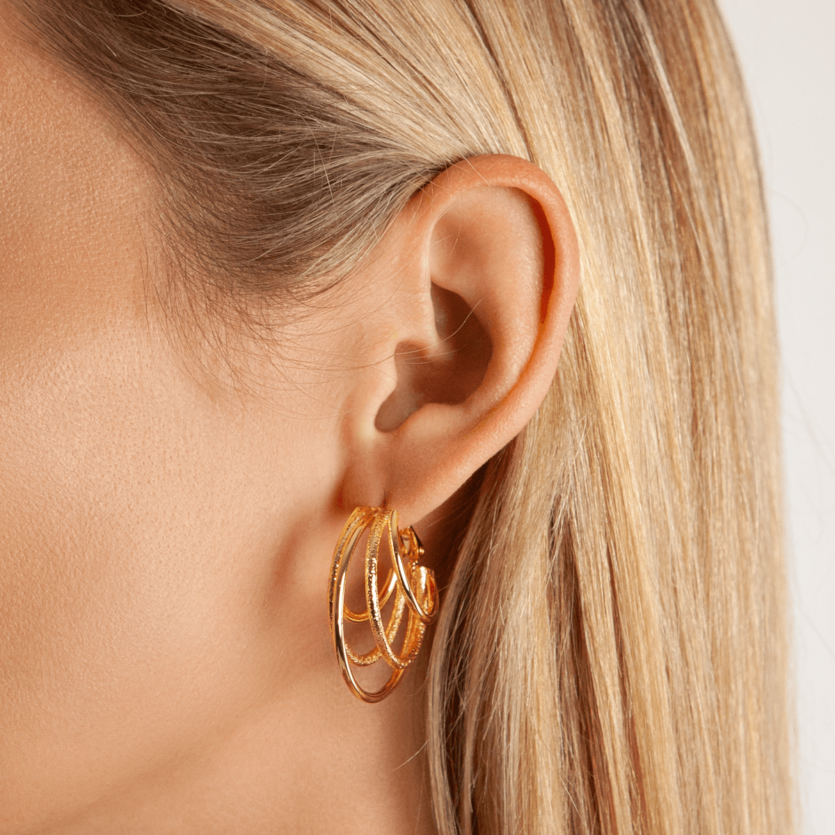 Model wearing Vivienne Multi Hoop Earrings Gold