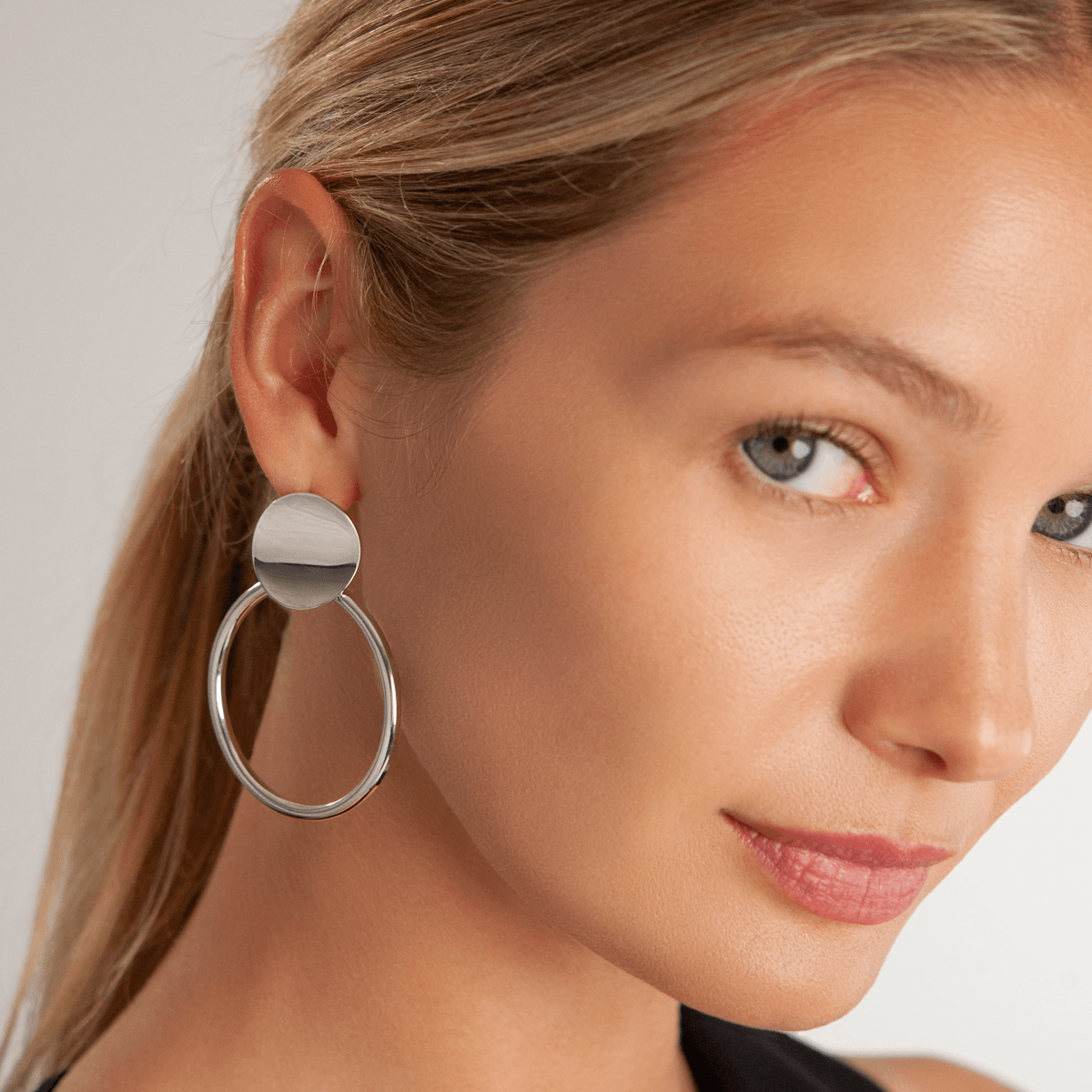 Model wearing Vivienne Circle Drop Earrings In White Gold