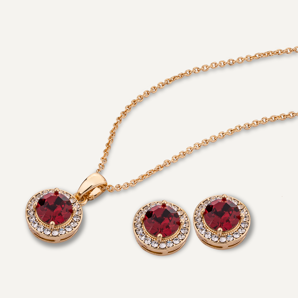 Close-up view of July Ruby Birthstone Necklace & Earring Set In Gold