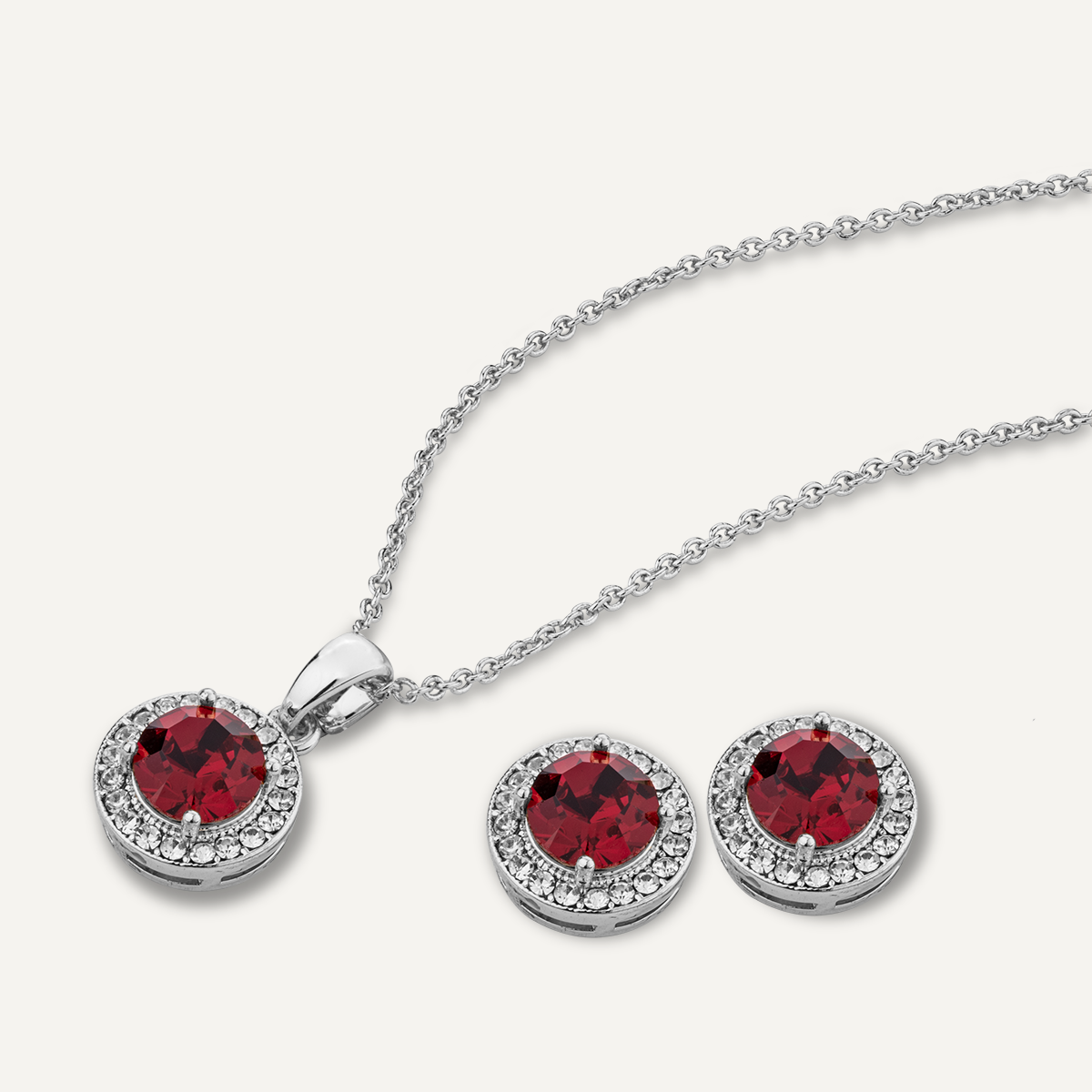 Close-up view of July Ruby Birthstone Necklace & Earring Set In Silver