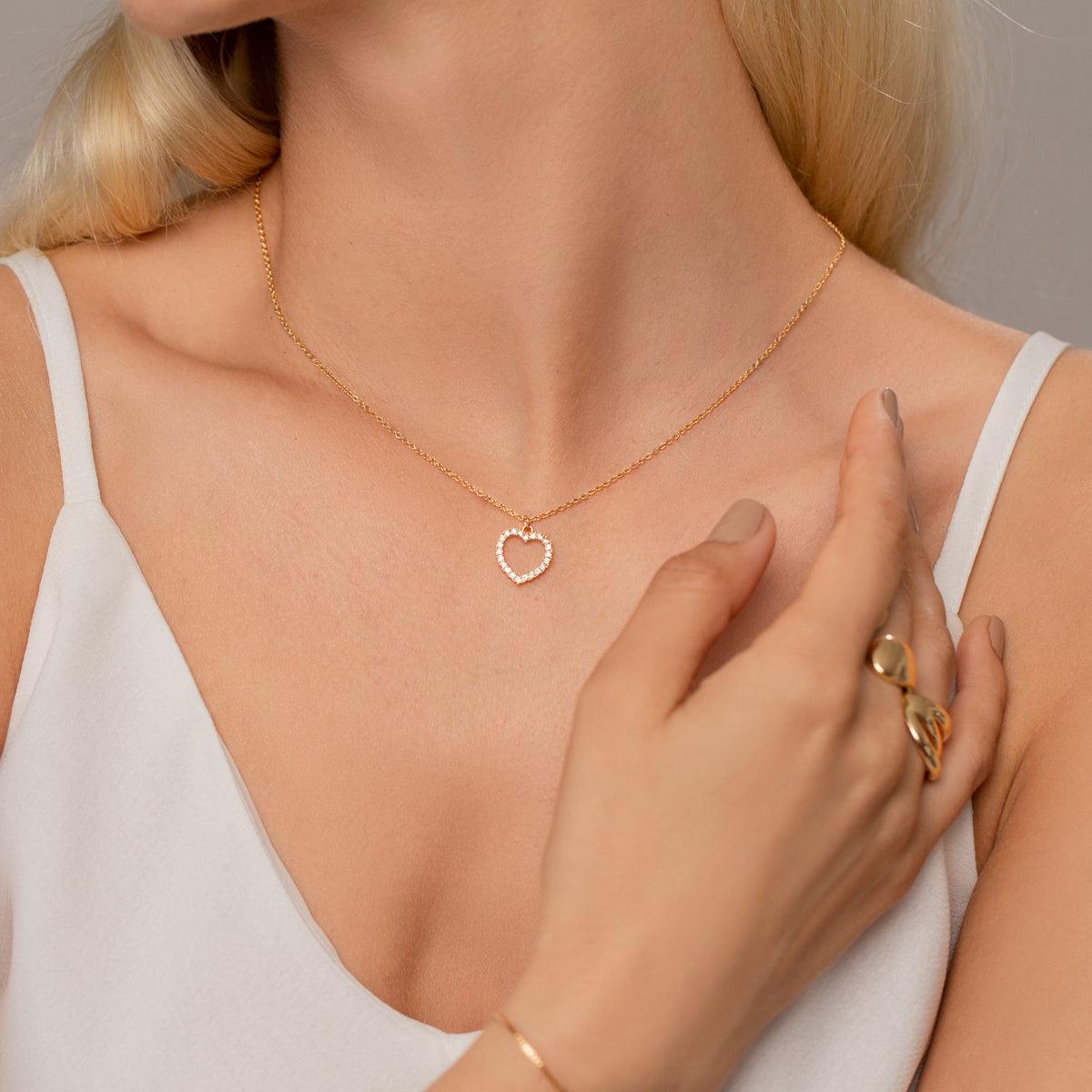Model wearing Vivienne Heart Pendant Necklace in Gold & Cubic Zirconia
