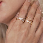 Model wearing Kylie Gold Cubic Zirconia Criss Cross Band Ring In Gold