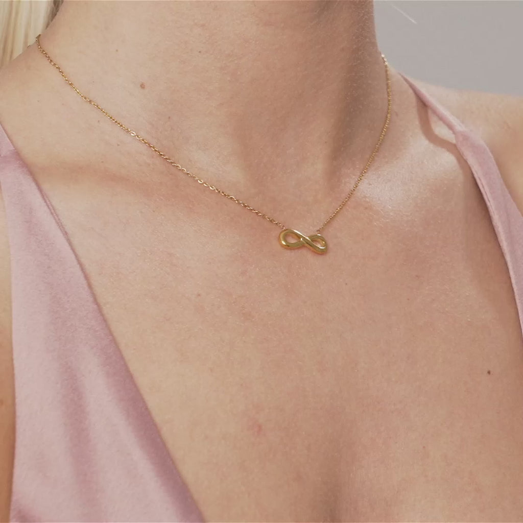 Model wearing Keira Infinity Symbol Pendant Necklace In Gold
