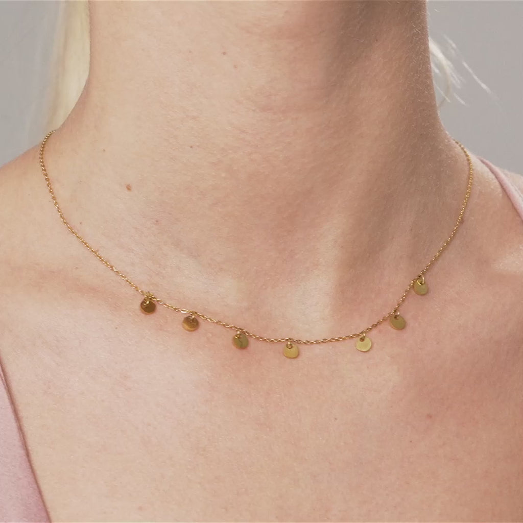 Model wearing Keira Gold Discs Short Necklace
