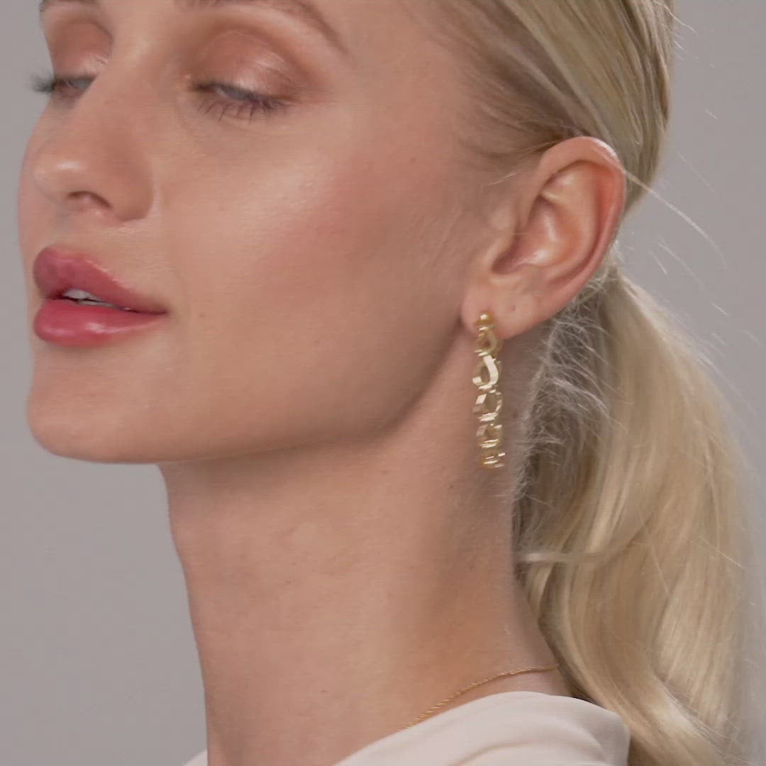 Model wearing the Alesha Contemporary Chain-Link Hoop Earrings in Gold